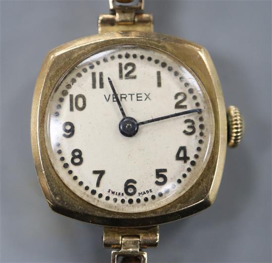 A ladys 9ct gold manual wind wrist watch, on a 9ct gold expanding bracelet.